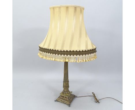 A brass Continental style Corinthian column table lamp fitted with twin bulbs, height to bayonet fitting 57cm, GWO 