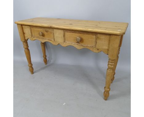 A pine console table, with 2 frieze drawers on baluster turned legs, 120cm x 77cm x 40cm 