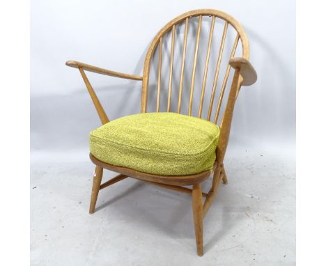 A mid-century Ercol beech low armchair, with original seat 