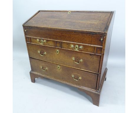 A 19th century oak bureau, with well fitted interior and 2 short and 2 long drawers below, on bracket feet, 91cm x 94cm x 52c