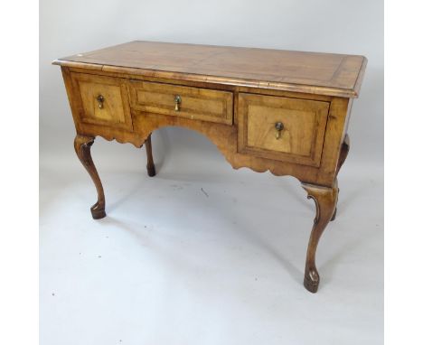 An Antique French crossbanded walnut kneehole writing table, with 3 frieze drawers, 115cm x 80cm x 54cm 