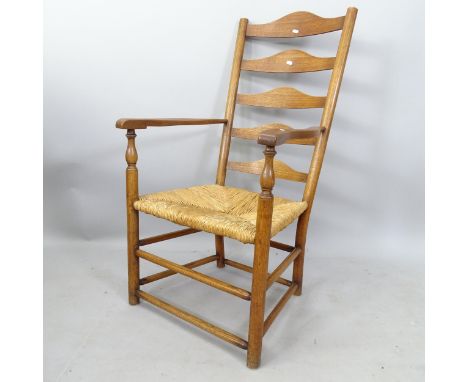A Cotswold School design rush-seated ladder-back armchair 