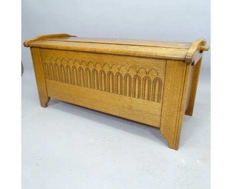 A modern contemporary light oak blanket box, with carved linenfold decoration, 99cm x 50cm x 48cm 