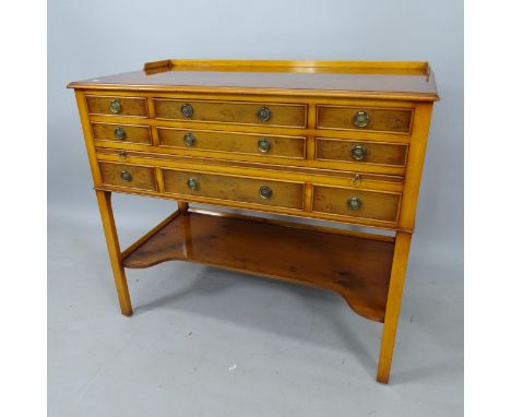 A yew wood washstand with raised gallery, 9 short drawers, and shaped shelf under, 97cm x 85cm x 51cm 