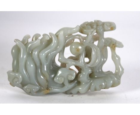 A GOOD CHINESE QING DYNASTY CELADON JADE CARVING OF BUDDA'S HAND, citron entwined with Lingzi fungus, peaches and a bat, 4 3/