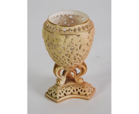 EARLY TWENTIETH CENTURY ROYAL WORCESTER PIERCED BLUSH CHINA VASE, of tapering form with three scroll supports and inverted tr