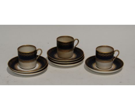 SET OF SIX LATE NINETEENTH CENTURY COPELAND SPODE PORCELAIN SAUCERS AND THREE MATCHING CUPS, decorated with jeweled dark blue