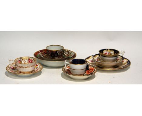 FOUR NINETEENTH CENTURY HAND PAINTED ENGLISH PORCELAIN CABINET CUPS AND SAUCERS, two with pattern numbers; 323 and 3859 and s
