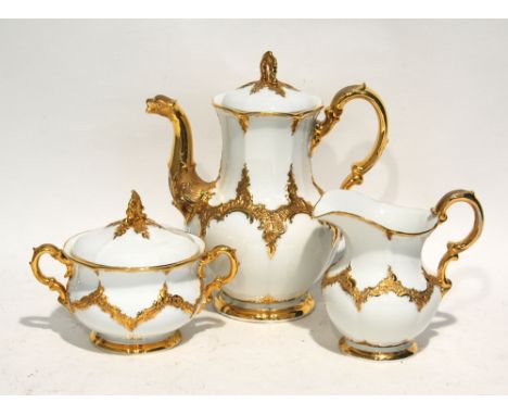 20th CENTURY MEISSEN PORCELAIN TEAPOT, CREAM JUG AND TWO HANDLED COVERED SUGAR BASIN, each modelled with rocaille scroll work