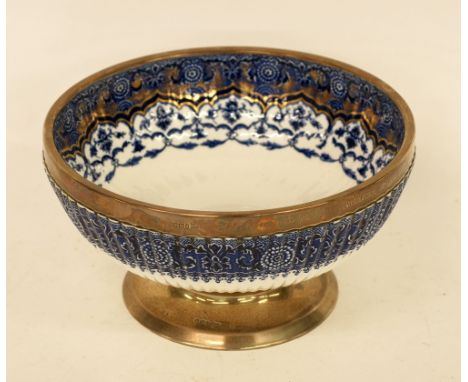 LATE NINETEENTH CENTURY COPELANDS CHINA PRESENTATION FRUIT BOWL, with hallmarked silver rim and foot, of steep sided lobated 