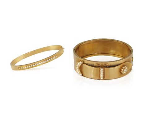 TWO 19TH CENTURY GOLD AND SEED PEARLS BANGLES, first: hinged, of buckle design accented with seed pearls, with gold security 