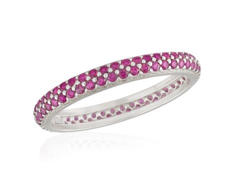 A RUBY ETERNITY RING, composed of two continuous rows of circular-cut rubies, mounted in 18K gold, Italian registry mark, rin