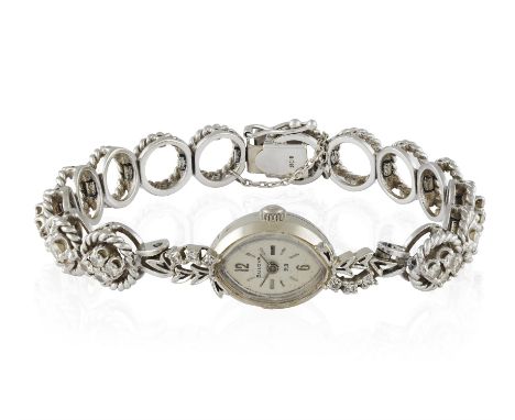 A LADY'S DIAMOND-SET COCKTAIL WATCH, BY BULOVA, of manual wind movement, navette silvered dial with Arabic and baton for nume