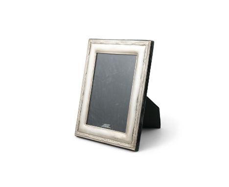 A MODERN SILVER RECTANGULAR PHOTOGRAPH FRAMEDublin 1983 with restrained Celtic style border. 19 x 14.5cm.