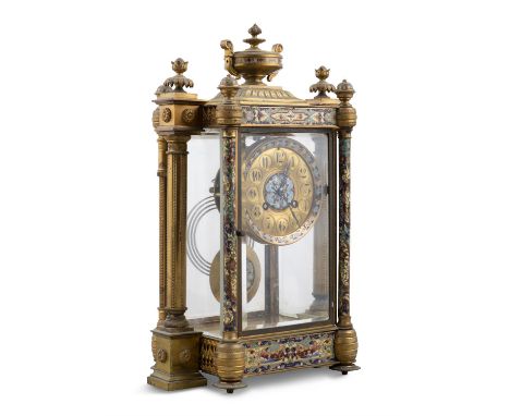 A CLOISONNÉ AND BRASS CASED MANTLE CLOCK OF ARCHITECTURAL FORM, Surmounted with an urn, the bevelled glass door enclosing a b