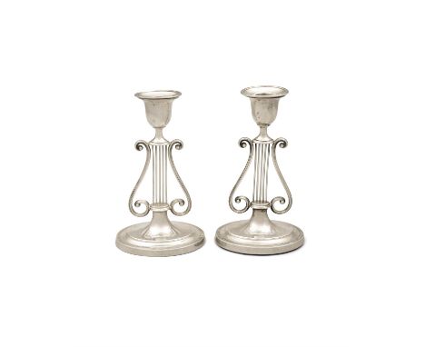 A PAIR OF SILVER CANDLESTICKSLondon c.1906, mark of Harrison Bros & Howson, each with detachable scones, raised on stems in t