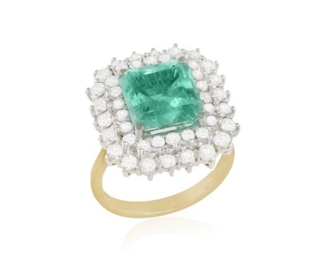 AN EMERALD AND DIAMOND CLUSTER RING, the rectangular cut-cornered emerald weighing approximately 4.50cts, within a brilliant-