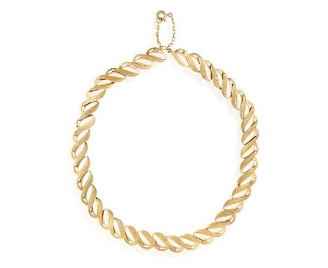 A GOLD NECKLACE, the polished and textured gold leaf links finishing with a cable-link chain near clasp, stamped 750, signed 