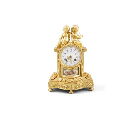 A PORCELAIN AND GILTMETAL MANTLE CLOCK, the circular enamel dial with roman numerals, surmounted by two puttis, above painted