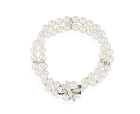 A CULTURED PEARL AND DIAMOND BRACELET, composed of two rows of cultured pearls with three spacers accented with a brilliant-c