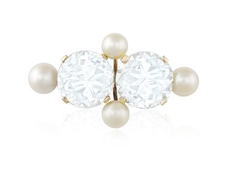 A TOPAZ AND CULTURED PEARL BROOCH, composed of two large circular-cut light blue topaz accented with four cultured pearls, mo