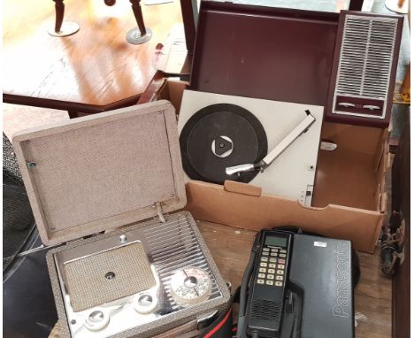 A Panasonic block portable phone (early mobile) with a a Pye vintage radio and a Philips portable record player 