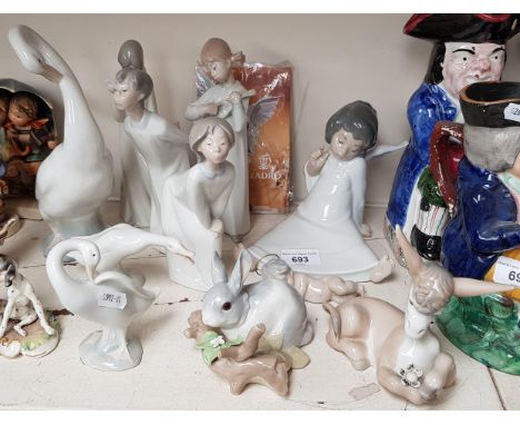 Seven Lladro figures, two others and a Nao large goose 