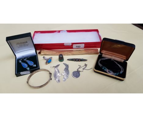 A mixed lot of mostly silver jewelery including enamelled silver, silver and turquoise ring, Mexican silver earrings, etc. 