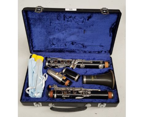 A Corton clarinet with case. 