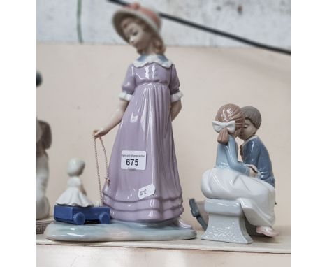 Two Lladro figures and a Nao figureCondition:- The Japanese figure, seated with flowers, has lost the end of the little finge