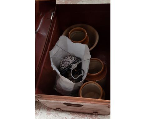 A tin trunk and contents including stoneware jars, a tortoise lamp, etc. 