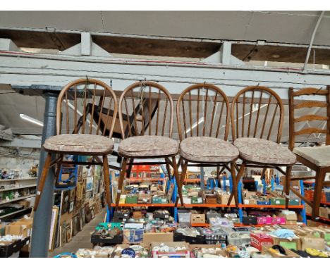 A set of four Ercol beech and elm 'Windsor' dining chairs. 