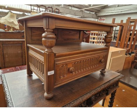 An Ercol elm TV stand. 