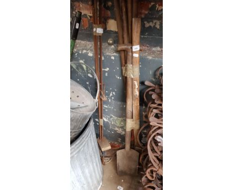 A bundle of garden tools and some sash clamps 
