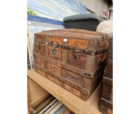 A vintage dome top travel trunk. 