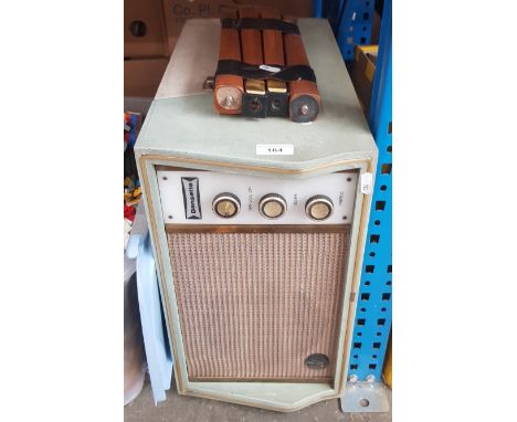 A vintage Dansette record player with legs. 