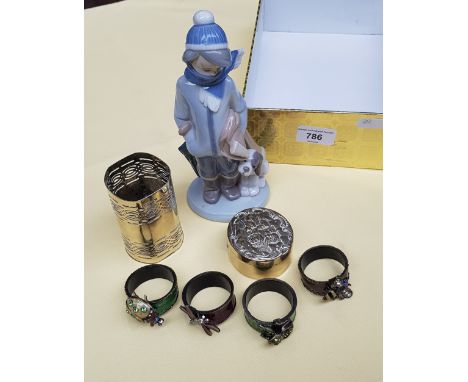 Lladro figure of a boy, enamel serviette rings and two pieces of brass 