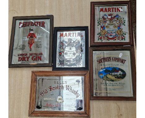 Five various advertising mirrors including Bell's Old Scotch Whisky, Beefeater Gin, Martini, etc. 