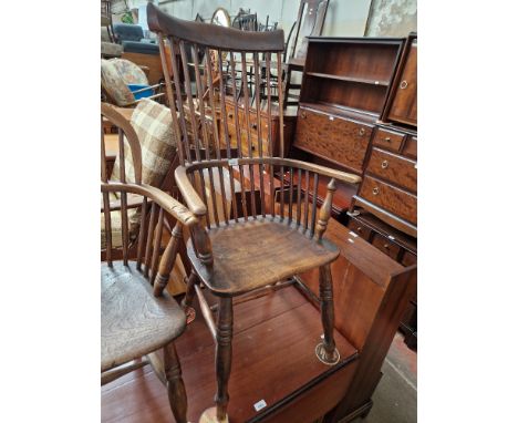 A 19th century beech and elm comb back Windsor chair. 