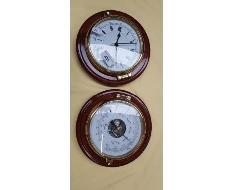 Circular mahogany and brass clock and a similar barometer 