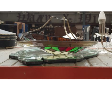A Tiffany style lamp shade and an oval mirror 