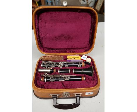 A Corton clarinet with case. 