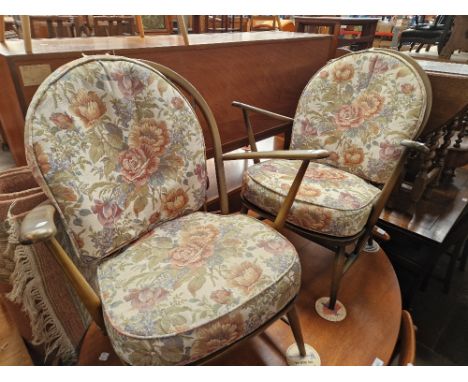 A pair of Ercol armchairs. 
