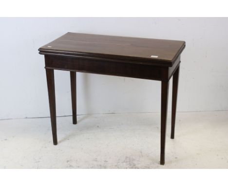 Early 19th century Mahogany Fold-over Card Table, the rectangular top with green baise playing surface, raised on square tape