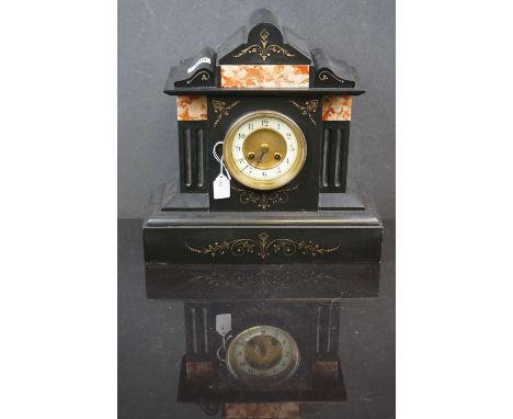 A French slated mantle clock with decorative marble panels, complete with key. 