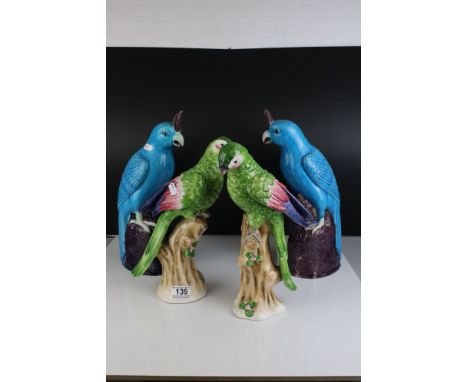 Two Turquoise / Blue Glazed Chinese style Parrots, impressed numbers to base, 35cms high together with Pair of Jeanne Reed's 