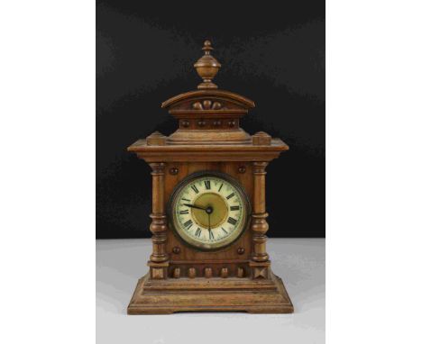 Early 20th century Oak cased mantel clock with column and finial decoration, 29cms high 