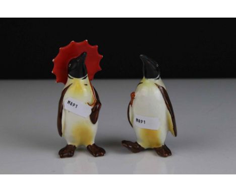 Two Beswick Penguins, including Penguin with Umbrella model 802 and Penguin with Walking Stick model 803 