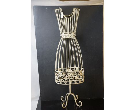 A painted metal wire work small female mannequin. 
