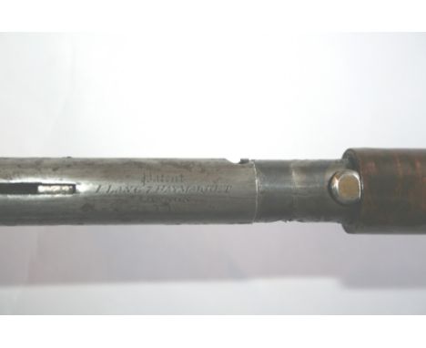 A LANG PERCUSSION WALKING STICK-GUN. An I Lang Patent of 7 Haymarket London N3 made concealed shotgun, as a folding action wa